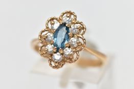 A 9CT GEM SET RING, the ring of a lozenge shape, set with a central marquise cut light blue