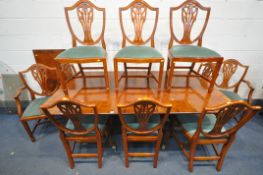 A YEW WOOD TWIN PEDESTAL DINING TABLE, with two additional leaves, open length 251cm x closed length