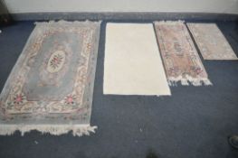 A GREEN WOOLLEN CHINESE RUG, 183cm x 123cm , two smaller Chinese rugs, and another rug (4)