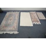 A GREEN WOOLLEN CHINESE RUG, 183cm x 123cm , two smaller Chinese rugs, and another rug (4)