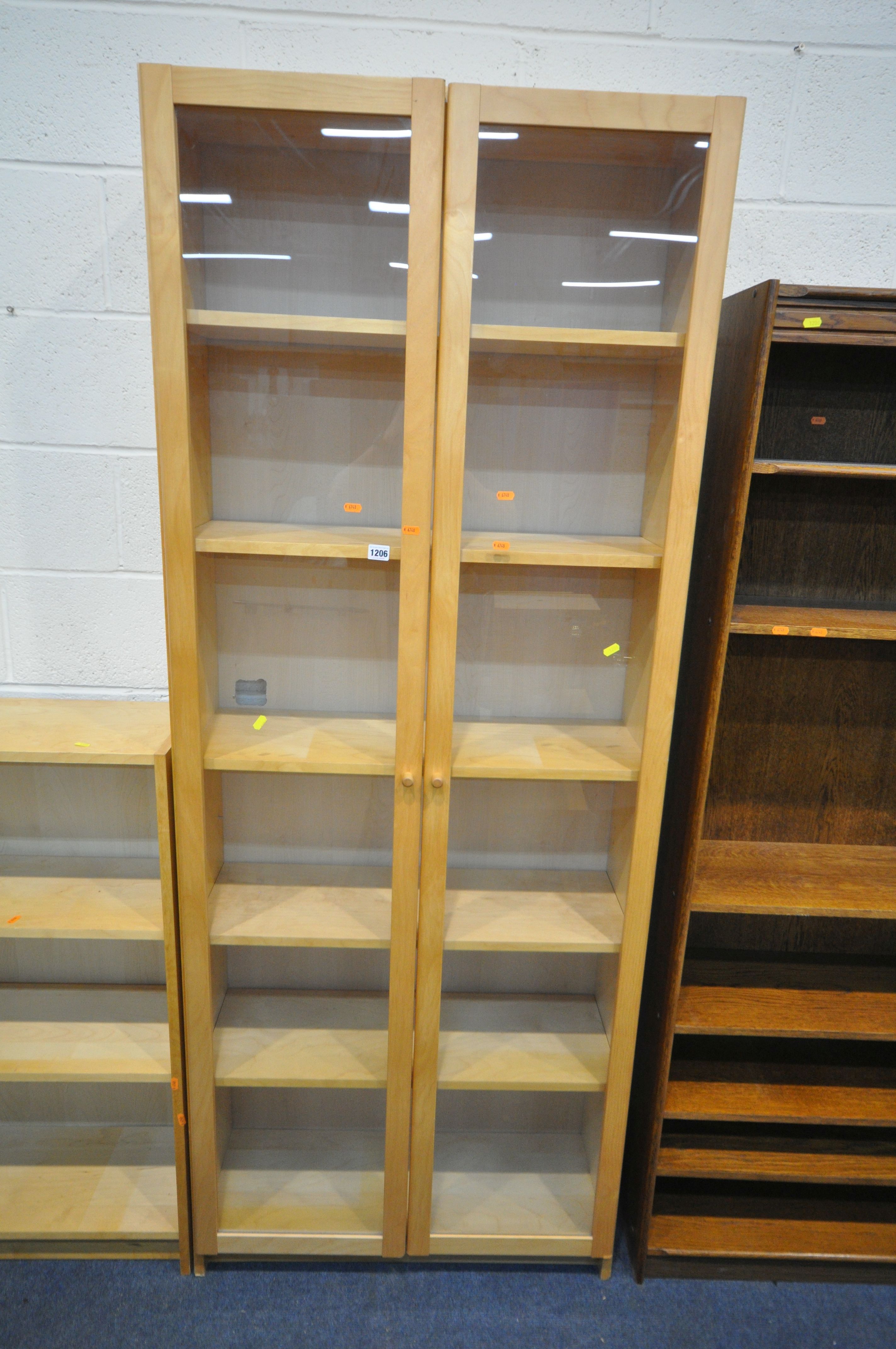 A MODERN BEECH GLAZED TWO DOOR BOOKCASE, enclosing five shelves, width 80cm x depth 31cm x height - Image 2 of 2