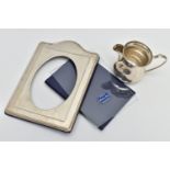 A SILVER PHOTO FRAME AND A MILK JUG, polished photo frame with beaded rim, oval aperture, hallmarked