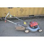 A HONDA IZY self-propelled petrol lawn mower, with grass box (condition:-engine starts first time