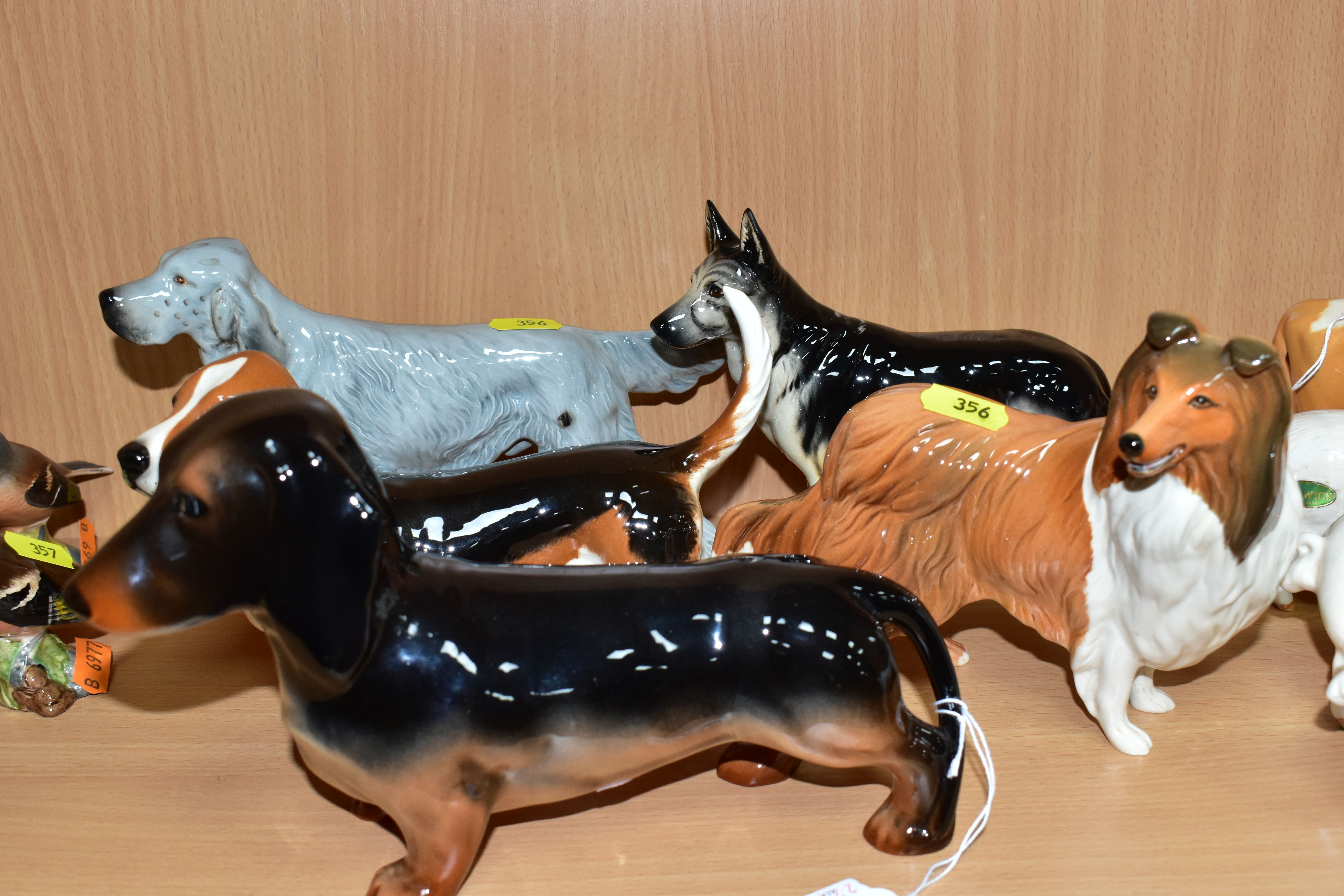 FIVE BESWICK DOGS, all gloss, comprising Basset Hound Fochno Trinket, no. 2045A, Dachshund -