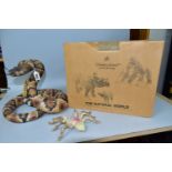 A BOXED COUNTRY ARTISTS MODEL OF A RATTLESNAKE AND A MODEL OF A TARANTULA, the coiled rattlesnake