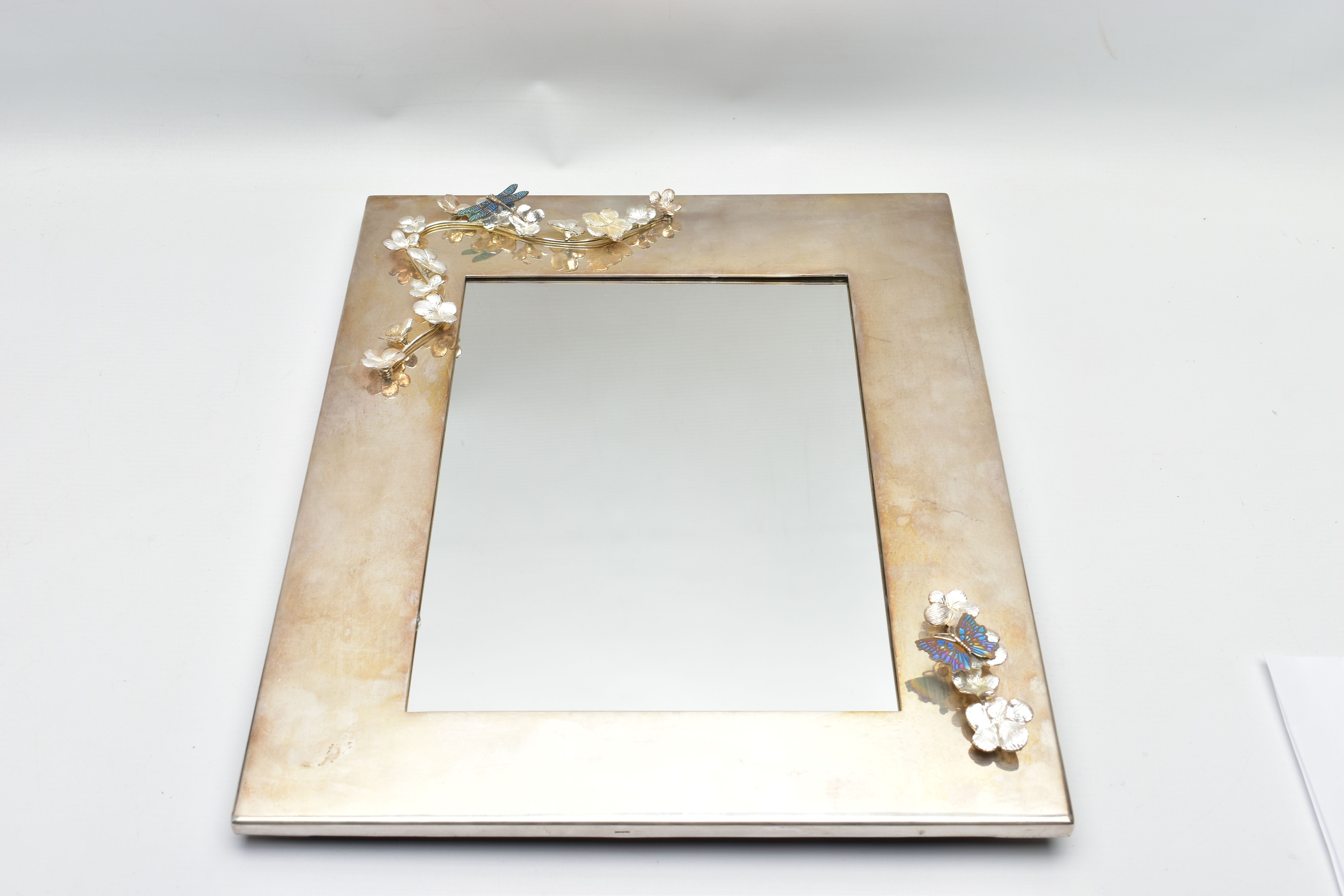 A 'MAPPIN & WEBB' SILVER PLATED MIRROR, of a polished rectangular form, decorated with applied