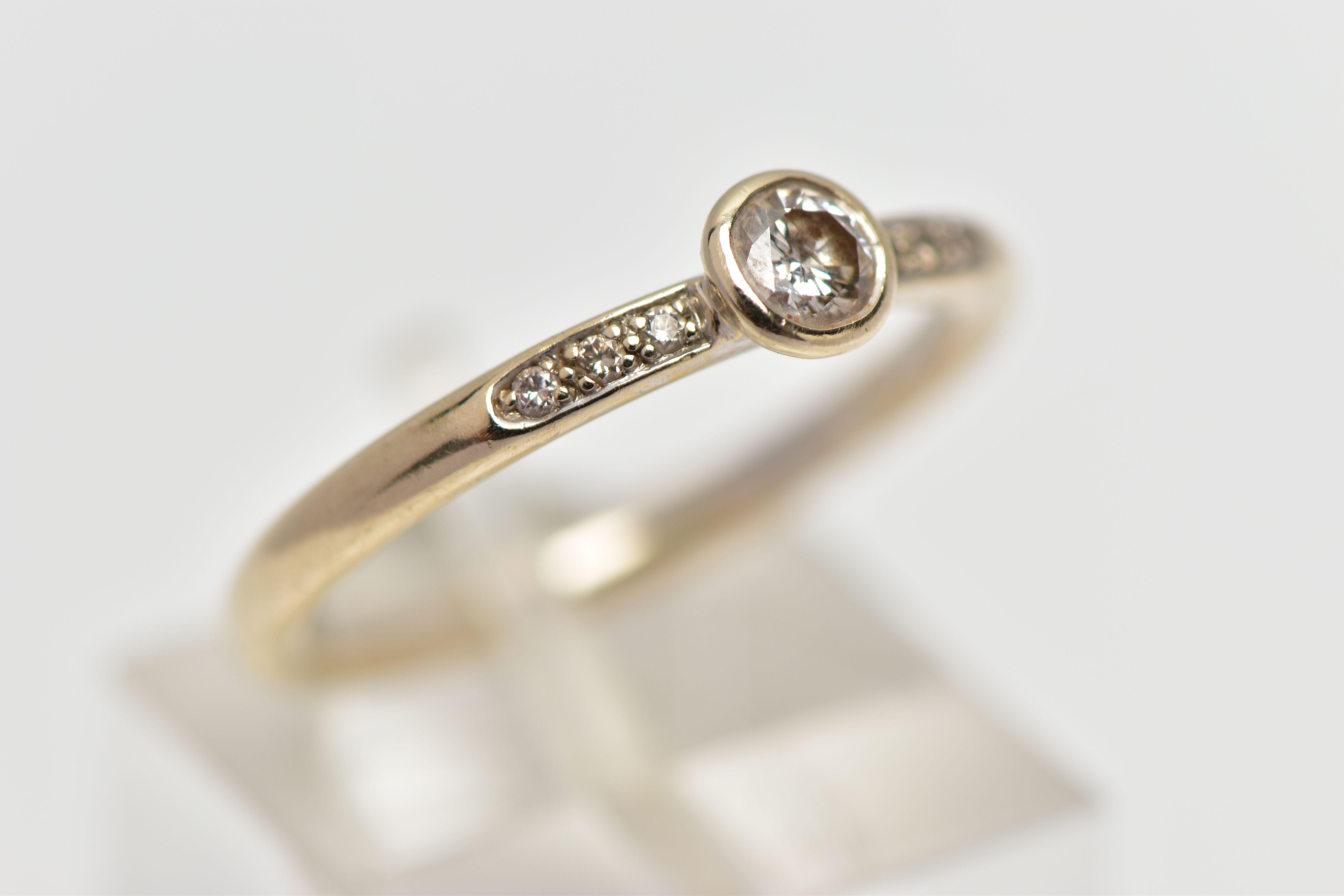 AN 18CT GOLD DIAMOND DRESS RING, the brilliant cut diamond within a collet setting, to the similarly - Image 4 of 4