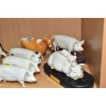 A BESWICK GUERNSEY COW, SECOND VERSION, MODEL NO. 1248B AND FIVE BESWICK PIGS, comprising 'Piggy