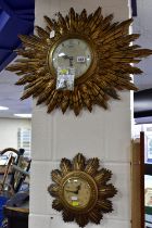 TWO SMITHS SUNBURST WALL CLOCKS, comprising one with double sunburst and silvered dial, key