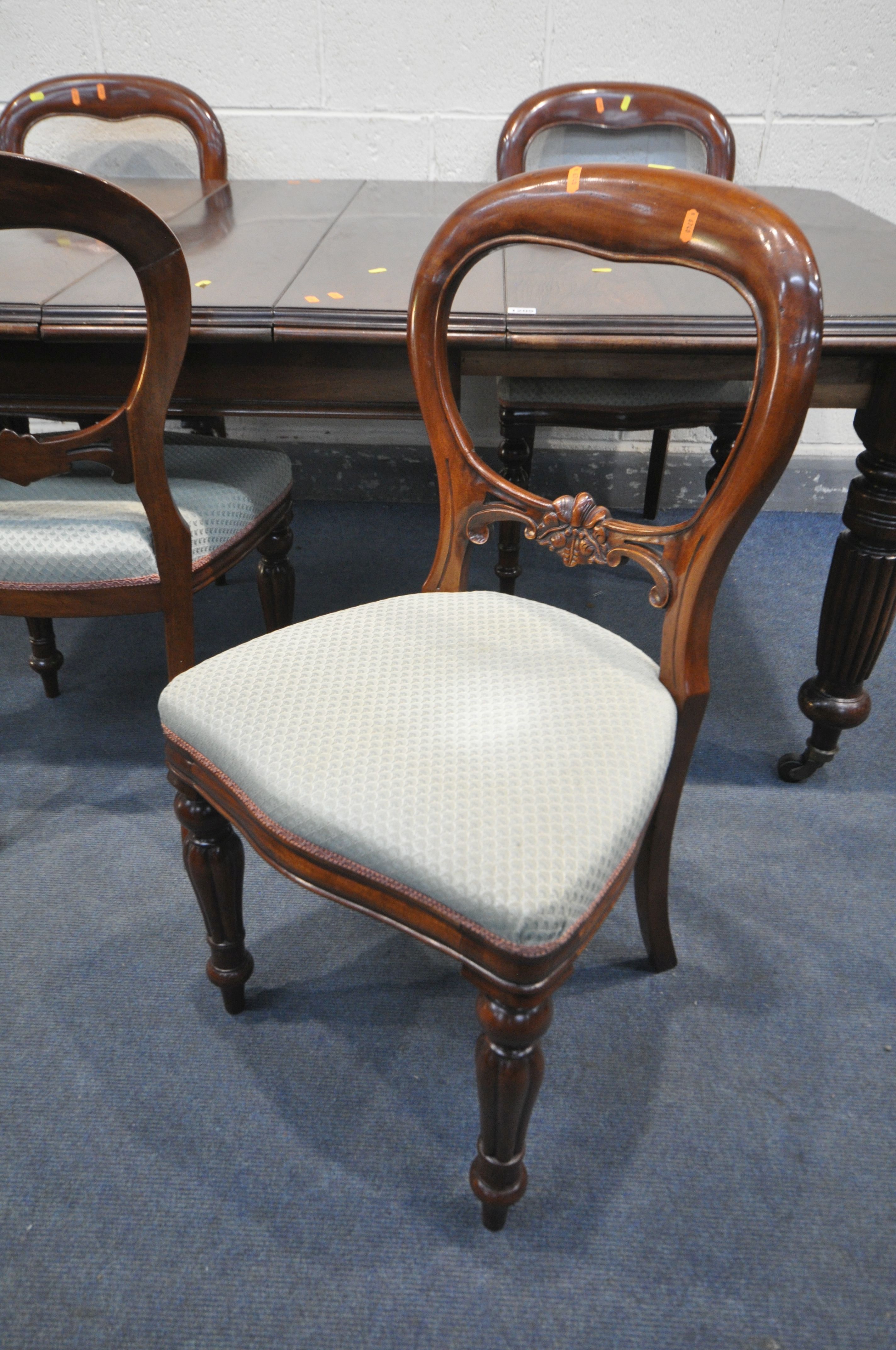 A VICTORIAN MAHOGANY WIND OUT DINING TABLE, with canted corners, two additional leaves, on fluted - Image 3 of 3