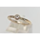 AN 18CT GOLD DIAMOND DRESS RING, the brilliant cut diamond within a collet setting, to the similarly