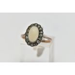 A MID 20TH CENTURY OPAL AND PASTE CLUSTER RING, set with a principal oval opal cabochon, within a