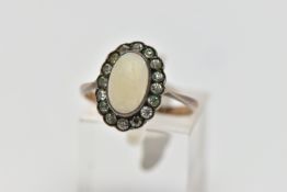 A MID 20TH CENTURY OPAL AND PASTE CLUSTER RING, set with a principal oval opal cabochon, within a