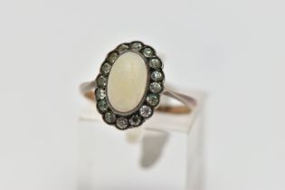 A MID 20TH CENTURY OPAL AND PASTE CLUSTER RING, set with a principal oval opal cabochon, within a