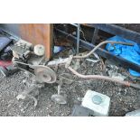 A VINTAGE WOLSELEY TITAN PETROL TILLER (condition:-rusty condition, engine seized)