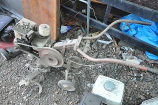 A VINTAGE WOLSELEY TITAN PETROL TILLER (condition:-rusty condition, engine seized)