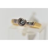 AN 18CT YELLOW GOLD DIAMOND RING, a single cut diamond bezel set in white gold, accented with two