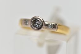 AN 18CT YELLOW GOLD DIAMOND RING, a single cut diamond bezel set in white gold, accented with two