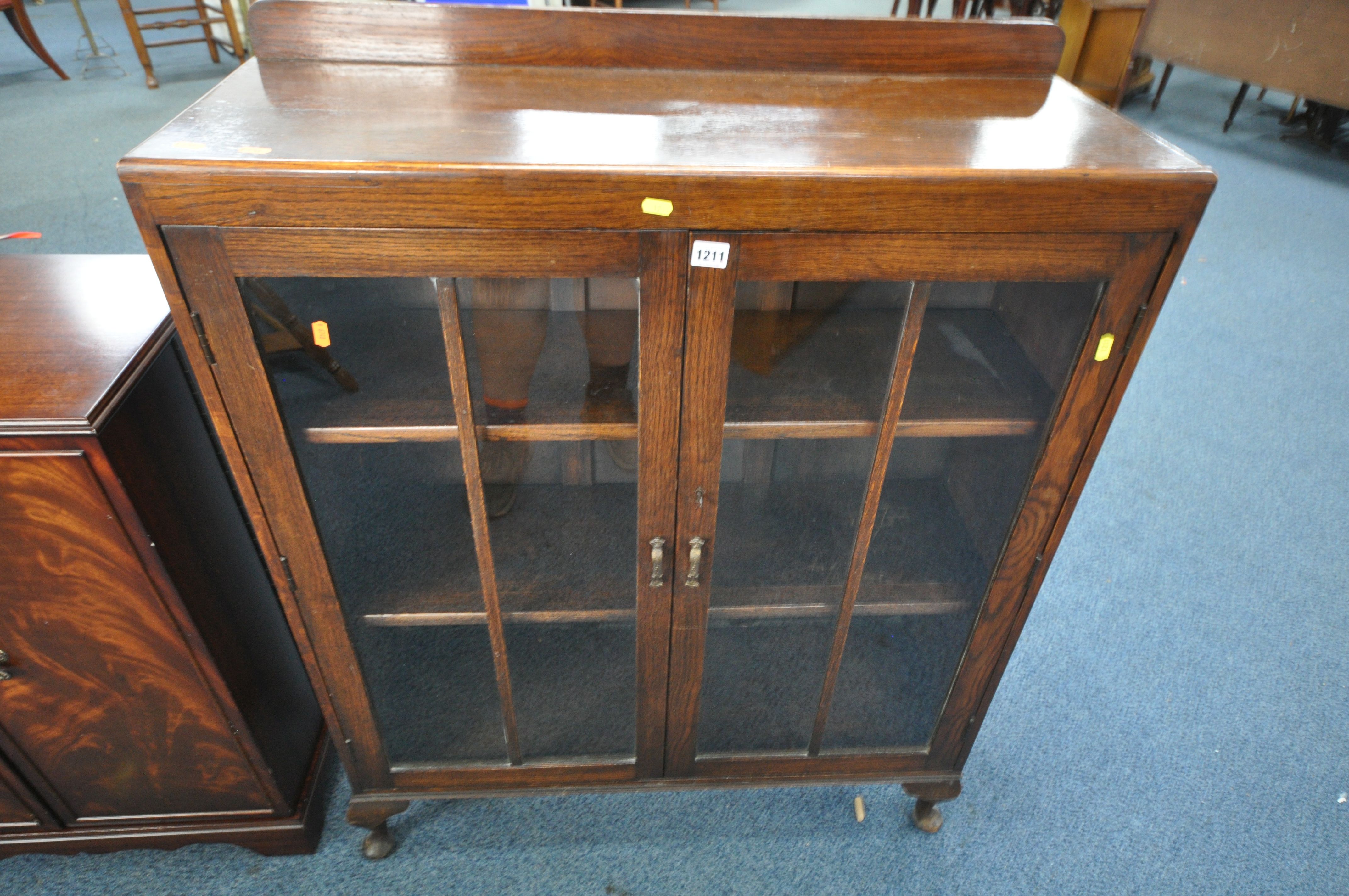 AN OAK GLAZED TWO DOOR BOOKCASE, width 92cm x depth 33cm x height 111cm (key) along with a teak - Image 2 of 3