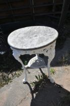 A CAST IRON PUB TABLE, with a weathered teak top, and a painted base, diameter 60cm x height 76cm