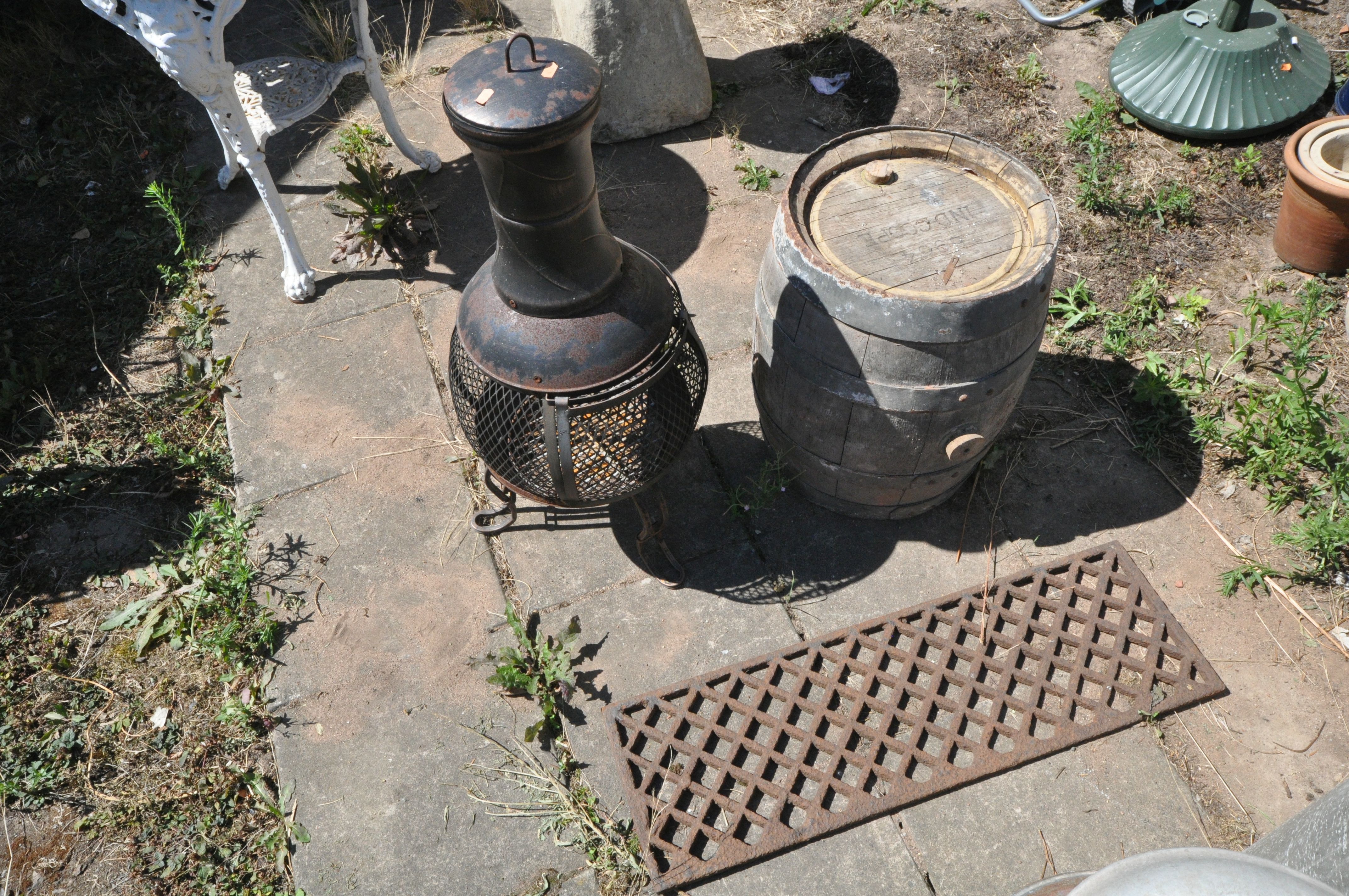 AN IND COOPE COOPERED BARREL, diameter 42cm x height 53cm, along with a metal chiminea, and a cast