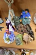 FOUR ROYAL DOULTON AND OTHER FIGURES AND FIVE CARVED STONE ITEMS, including Tuppence A Bag,