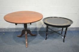 AN EBONISED AND FLORAL GILT OVAL OCCASIONAL TABLE, with a removable tray, on a faux bamboo base,