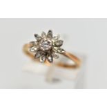 AN 18CT GOLD DIAMOND FLORAL CLUSTER RING, the central brilliant cut diamond, claw set, to the single