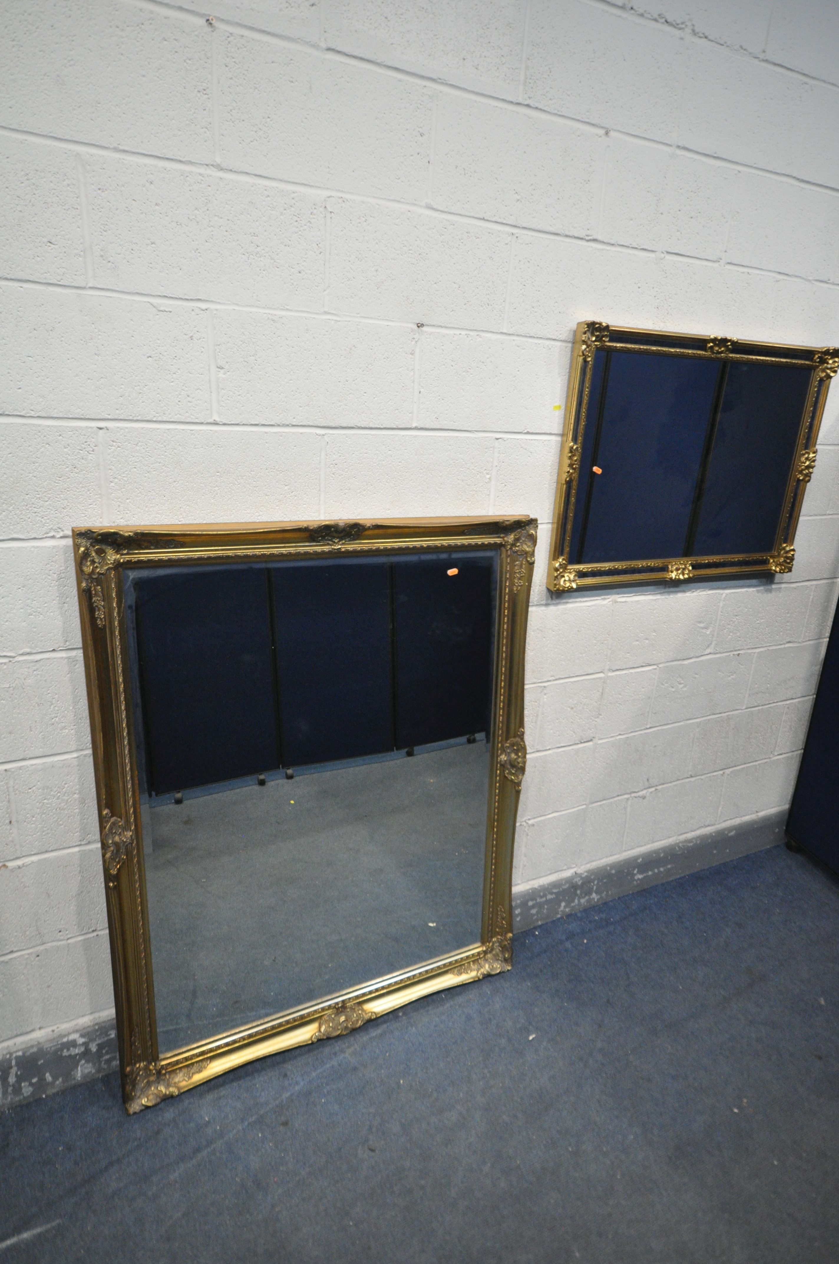 A LARGE GILT FRAMED BEVELLED EDGE MIRROR, 133cm x 107cm, along with another gilt framed mirror