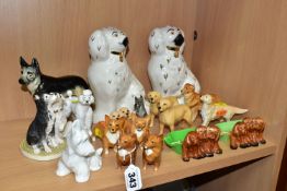 A GROUP OF SIXTEEN ASSORTED BESWICK DOG FIGURES AND A ROYAL DOULTON TERRIER, including two pipe