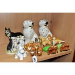 A GROUP OF SIXTEEN ASSORTED BESWICK DOG FIGURES AND A ROYAL DOULTON TERRIER, including two pipe