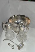 A GROUP OF SILVER PLATED ITEMS, to include a pair of cut glass plated claret jugs, a large punch