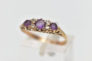A 9CT GOLD AMETHYST AND CUBIC ZIRCONIA DRESS RING, the circular cut amethyst and similarly cut cubic
