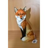 A ROYAL WORCESTER FIGURE OF A SEATED SLY LOOKING FOX, model no. 2993, black printed mark, height