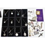 A BOX OF MOSTLY WHITE METAL JEWELLERY, to include twelve boxed (new like condition) pendant