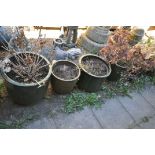 SEVEN VARIOUS GLAZED PLANTERS, of various sizes, four containing plants, largest planter diameter