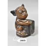 A FIRST HALF 20TH CENTURY PAINTED METAL BONZO MONEY BOX, the dog cast holding a briefcase, reg no.
