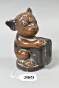 A FIRST HALF 20TH CENTURY PAINTED METAL BONZO MONEY BOX, the dog cast holding a briefcase, reg no.