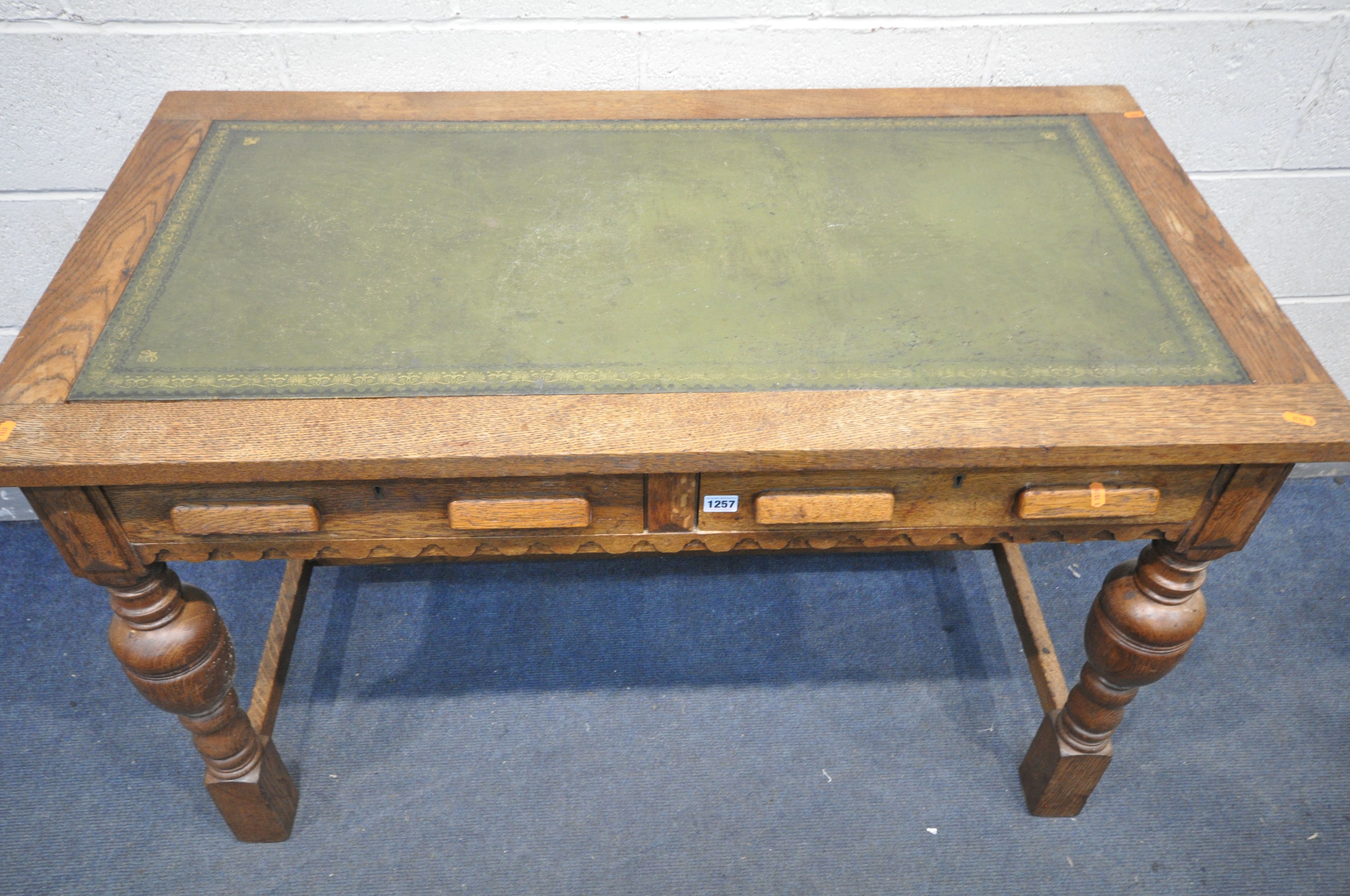 A 20TH CENTURY SOLID OAK WRITING DESK, with green leather inlay, two frieze drawers, on acorn - Bild 2 aus 3