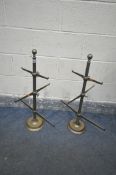 A PAIR OF BRASS JEWELLEY HOLDERS, with three adjustable graduated tiers, height 75cm