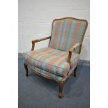 A LOUIS XV STYLE ARMCHAIR, with stripped upholstery and open armrests, width 72cm x depth 76cm x