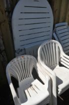 A PLASTIC EXTENDING GARDEN TABLE, length 178cm x depth 95cm, and two sets of four armchairs (