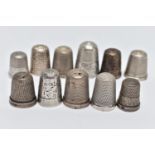 AN ASSORTMENT OF SILVER AND WHITE METAL THIMBLES, comprising eight silver thimbles of various