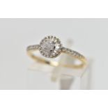 A 9CT YELLOW AND WHITE GOLD DIAMOND CLUSTER RING, set with a principal round brilliant cut