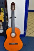 A C GIANT ACOUSTIC GUITAR, with adjustable stand (2) (Condition report: generally appears in fair
