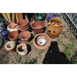A SELECTION OF MOSTLY TERRACOTTA GARDEN PLANTERS, to include a strawberry/herb planter, a low