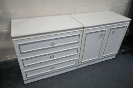 A WHITE CHEST OF THREE DRAWERS, and a matching two door cupboard (2)