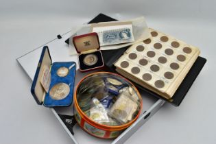 A TIN AND FILE CASE OF COINS AND BANKNOTES, to include a cased set of Sir Winston Churchill