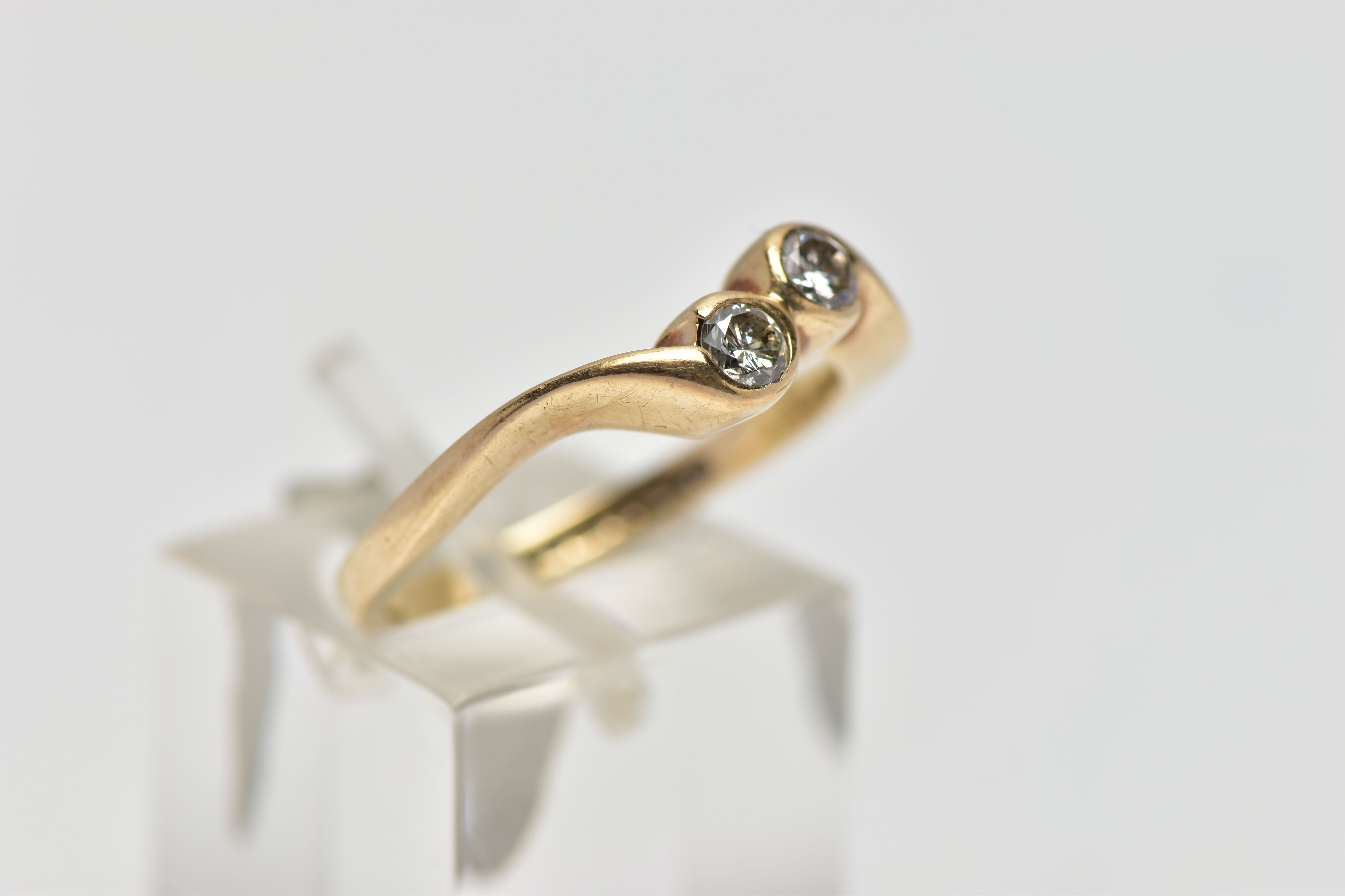 A 9CT YELLOW GOLD DIAMOND TWO STONE CROSSOVER RING, set with two round brilliant cut diamonds, - Image 4 of 4