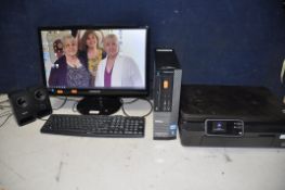 A DELL KXGVD COMPUTER TOWER with a Samsung LS22A100NS monitor, unbranded keyboard, mouse and a HP